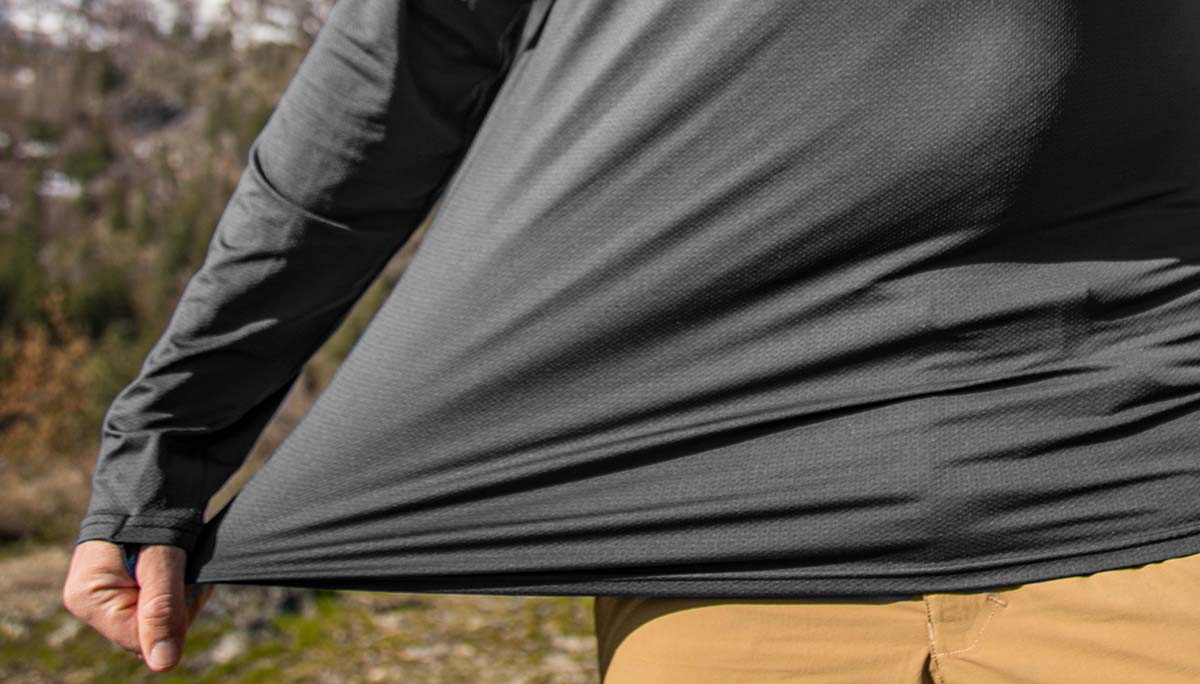 Man wearing Manatee Grey Geo T showcasing the 4-Way Stretch