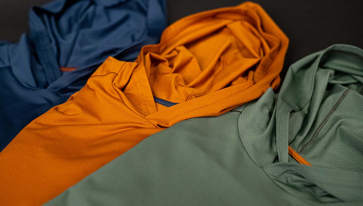 Mens Geo T Hooded LS Shirt colors Steel Blue, Rust and Dark Mint laid down next to each other