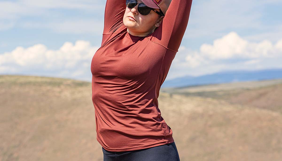 Woman wearing Mars Red Geo T Shirt showing the stretch