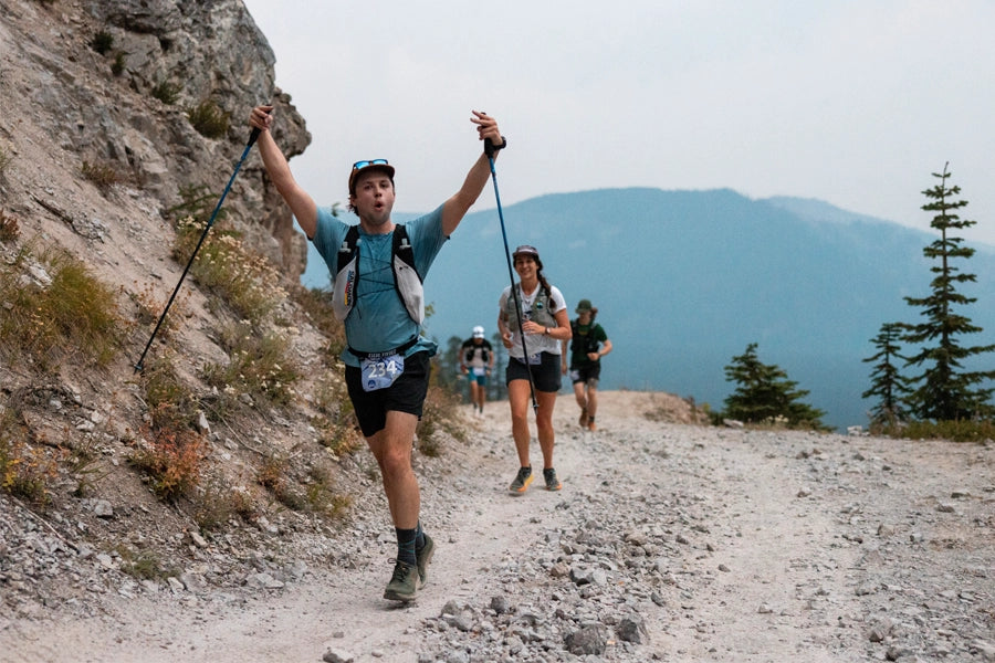 Ultramarathon racer Zach Zenteno running on a rocky mountain trail while wearing the SolarSwift Tech-T in Big Sky Blue.