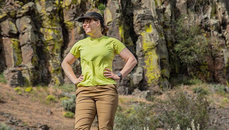 Women wearing the Feathers Tech-T in Light Lime and the Tinkham Pants by Beyond Clothing. 