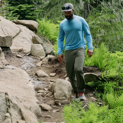 Man hiking a trail in the Men's Geo-T Crew L.S. by Beyond Clothing.com