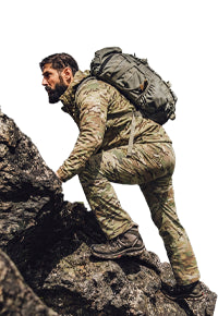 Warrior climbing a mountain in the L4 Back Country LT Back Country Collection.