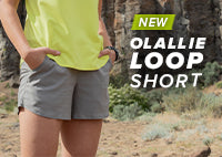 Women taking a break during a hike with her hands in her pockets of the OlallieLoop Short. 