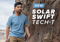 Man hiking in the SolarSwift Tech-T in the color big sky blue.