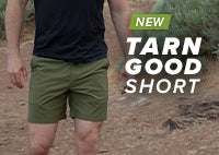 Men walking in the Tarngood Short in the color evergreen.