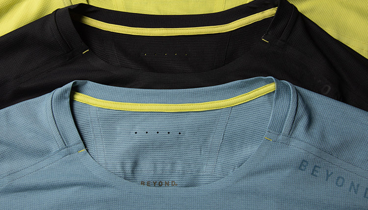 Close up highlight image of the glue bonded hems and venting holes on the Solarswift shirt by Beyond Clothing.
