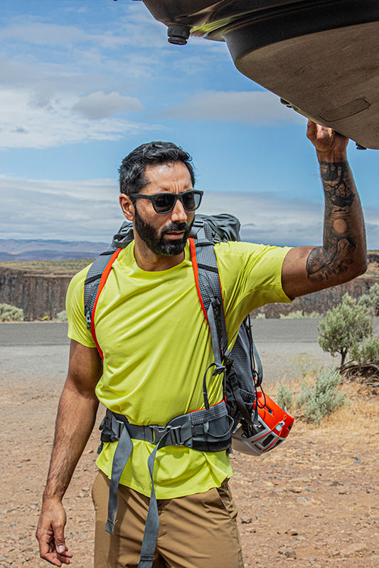 Man wearing the Light Lime colored SolarSwift Tech-T and the Tobacco TarnGood pants. #group_light-lime