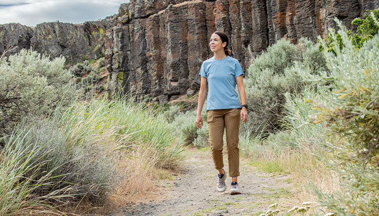 Women trail hiking in the Tinkham Pants by Beyond Clothing.
