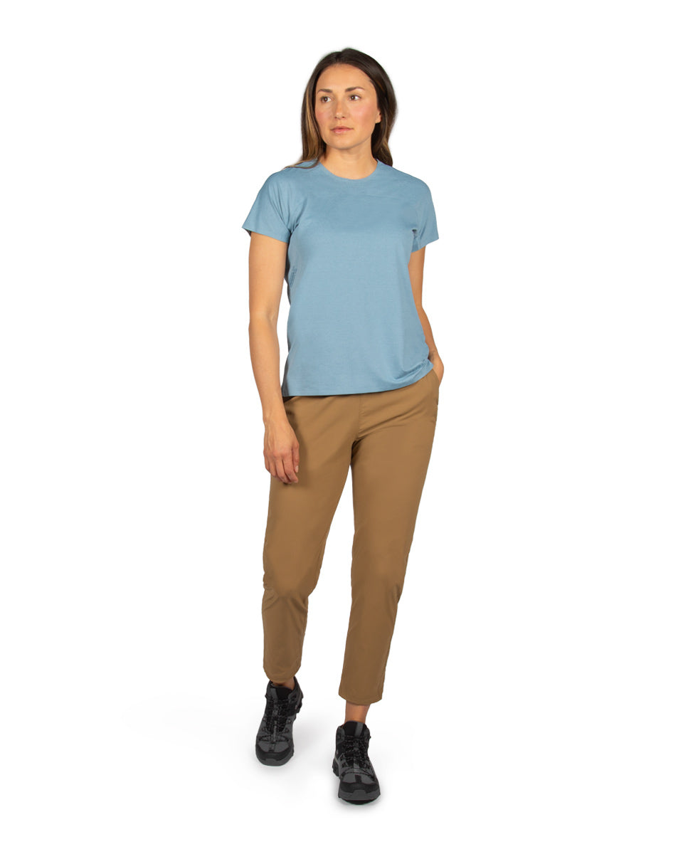 Woman model wearing the Tinkham Pant and Feathers Tech-T. 