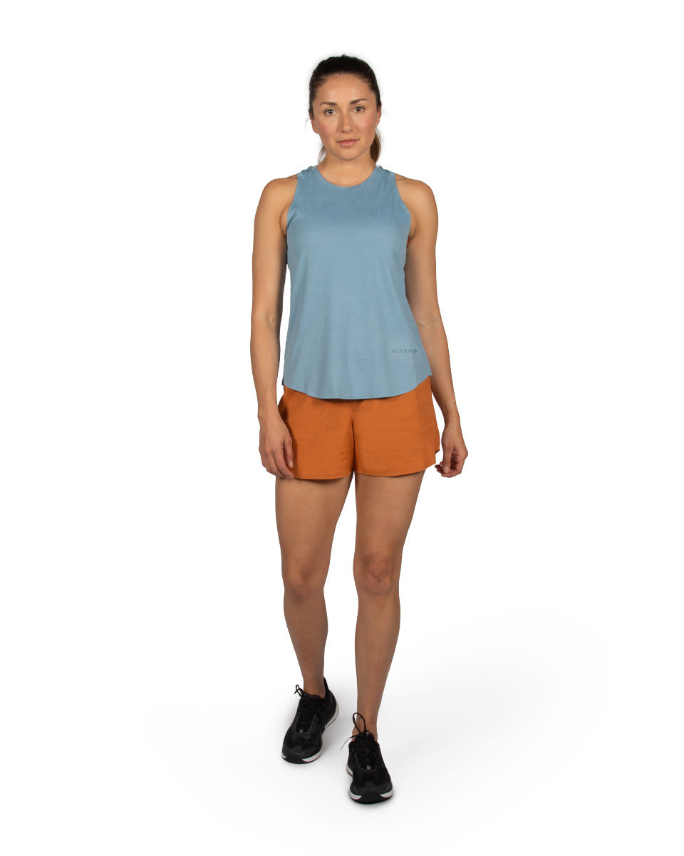 Woman model wearing the OlallieLoop Short and Feathers Tech-Tank. 