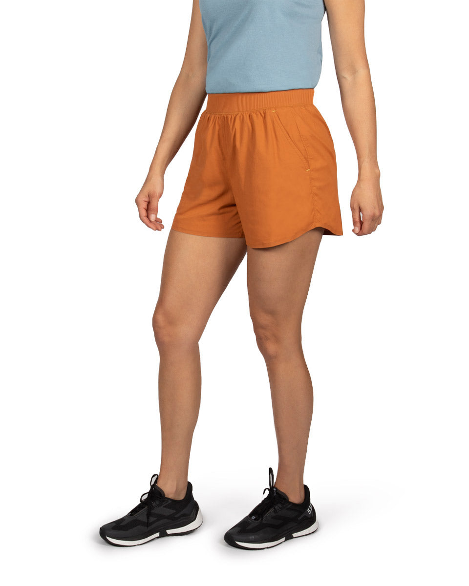 Woman model wearing the OlallieLoop Short and Feathers Tech-Tank. 