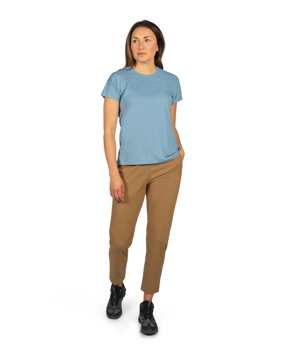 Woman model wearing the Feathers Tech-T and Tinkham Pant. 