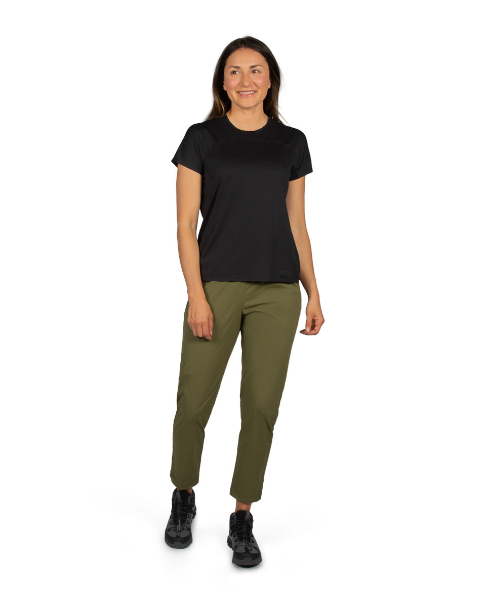 Woman model wearing the Feathers Tech-T and Tinkham Pant. 