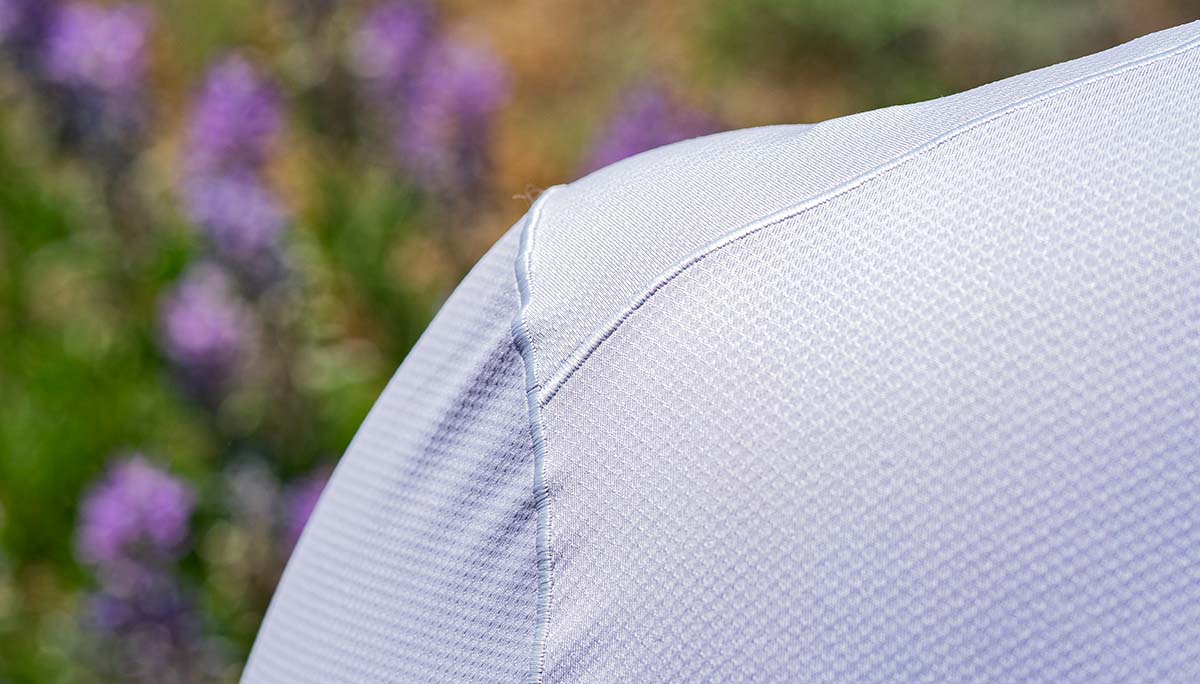 Close up photo of woman wearing the Lilac Grey Geo T. Showing off the knit pattern